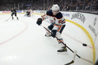 Edmonton Oilers center Ryan Nugent-Hopkins plays the puck during the first period in Game 6 of an NHL hockey Stanley Cup first-round playoff series against the Los Angeles Kings Thursday, May 12, 2022, in Los Angeles. (AP Photo/Mark J. Terrill)