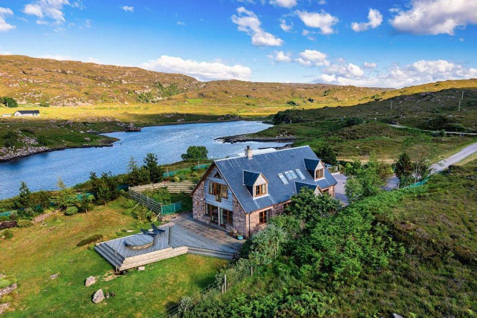 <p>Sitting on the Ard Dhubh Peninsula in Scotland, this stunning home with four en-suite <a href="https://www.housebeautiful.com/uk/lifestyle/storage/a29144268/small-bathroom-storage/" rel="nofollow noopener" target="_blank" data-ylk="slk:bathrooms" class="link ">bathrooms</a> offers tranquil views. Thanks to the clear skies and little light pollution, it's a great spot to take in the northern lights. You're also just a short walk from a remote white sandy beach and the scenic harbour.</p><p>This property is currently on the market for £595,000 with Paton & Co via <a href="https://www.rightmove.co.uk/properties/124603484#/?channel=RES_BUY" rel="nofollow noopener" target="_blank" data-ylk="slk:Rightmove" class="link ">Rightmove</a>.</p>