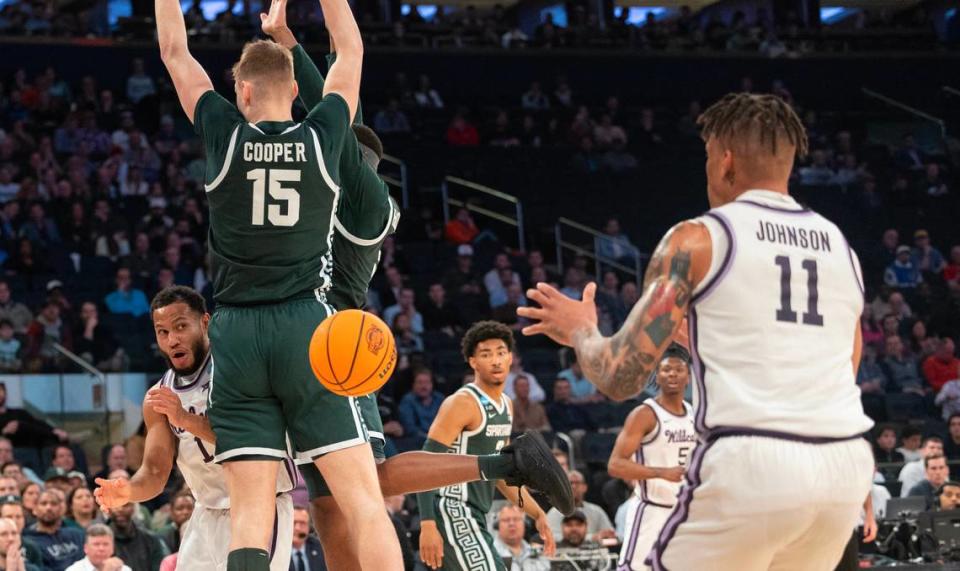 Kansas State’s Markquis Nowell makes an assist to teammate Keyontae Johnson during the first half of their east region semifinal game against Michigan State at Madison Square Garden on Thursday night.