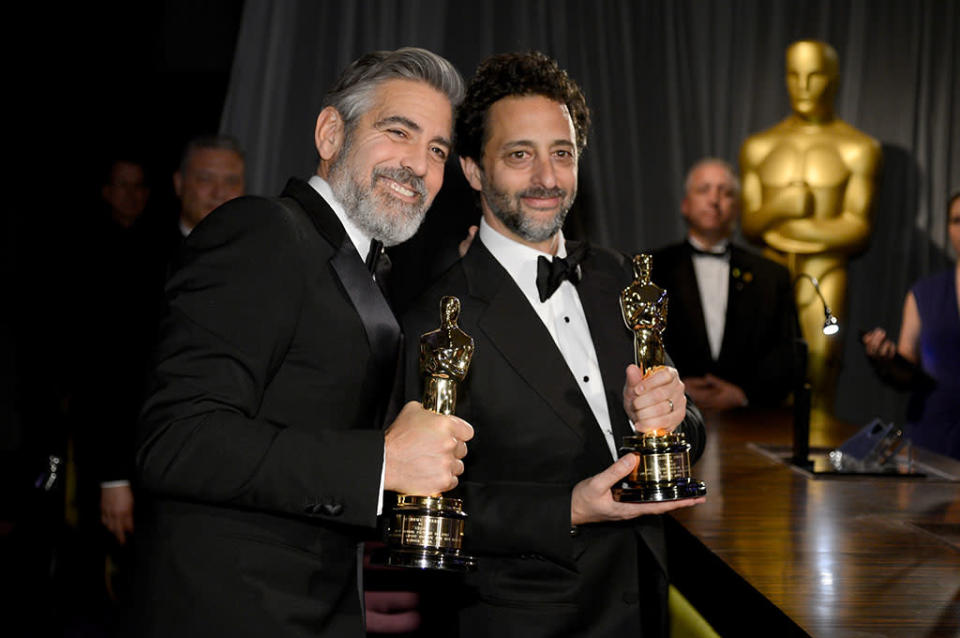 Producers George Clooney and Grant Heslov, winners of the Best Picture award for 'Argo,' attend the Oscars Governors Ball at Hollywood & Highland Center on February 24, 2013 in Hollywood, California.