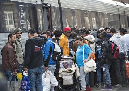 Migrants, mainly from Syria, prepare to board a train headed for Sweden, at Padborg station in southern Denmark September 10, 2015. REUTERS/Claus Fisker/Scanpix Denmark