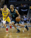 Charlotte Hornets guard Tony Parker, right, drives past Los Angeles Lakers guard Sviatoslav Mykhailiuk, of Ukraine, in the first half of an NBA basketball game in Charlotte, N.C., Saturday, Dec. 15, 2018. (AP Photo/Nell Redmond)