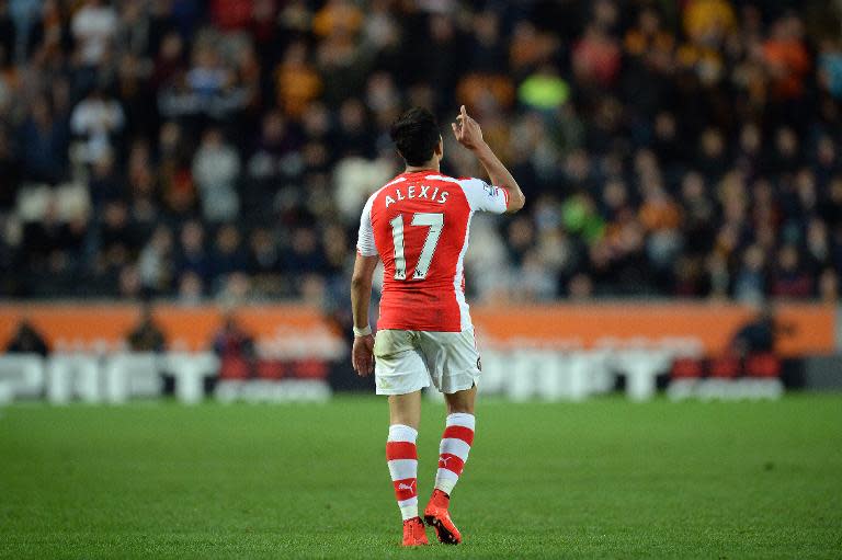 Arsenal's Chilean striker Alexis Sanchez celebrates scoring a goal during the English Premier League football match between Hull City and Arsenal in Hull, England, on May 4, 2015