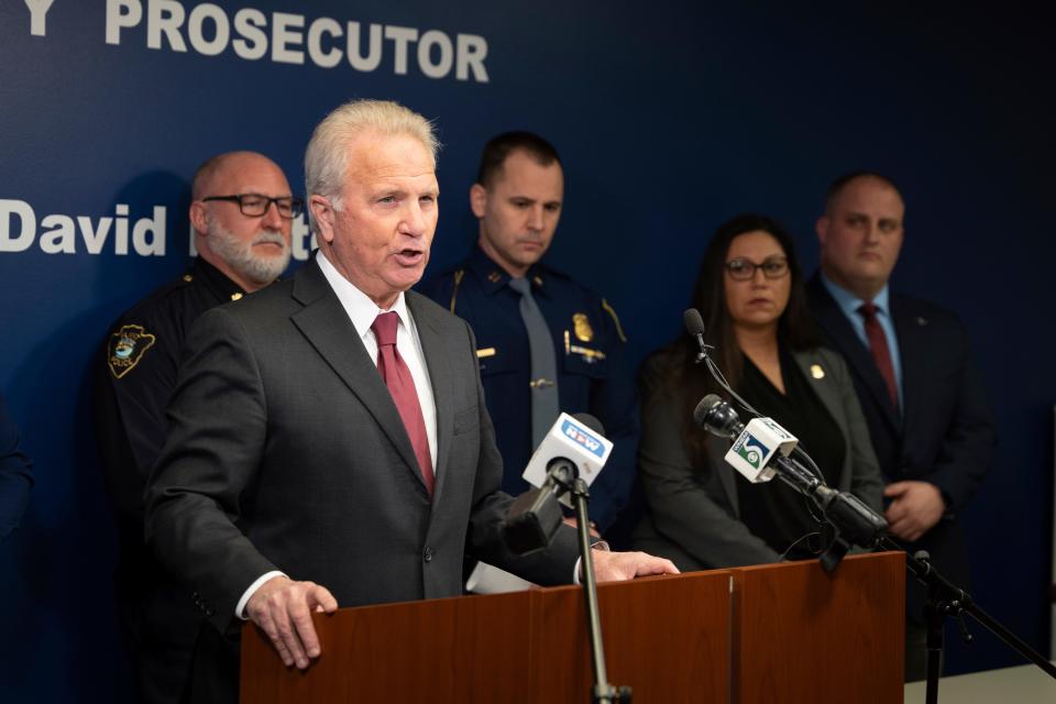 Genesee County Prosecutor David Leyton speaks during a news conference to announce criminal charges filed against a Flint father, after his 2-year-old daughter accidentally shot herself, held in the 67th District Court in downtown Flint, Mich., on Tuesday, Feb. 20, 2024. Under Michigan's new "safe storage" laws, this is the first criminal complaint filed.