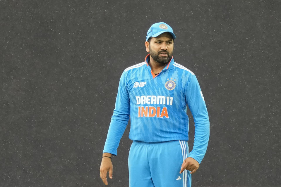 India's captain Rohit Sharma stands in the field as it drizzles during the Asia Cup cricket match between India and Nepal in Pallekele, Sri Lanka on Monday, Sep. 4. (AP Photo/Eranga Jayawardena)