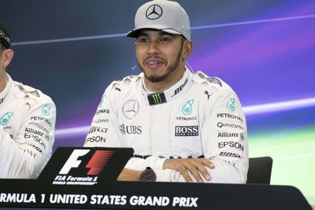 Oct 22, 2016; Austin, TX, USA; Mercedes driver Lewis Hamilton (44) of Great Britain is interviewed after qualifying for the United States Grand Prix at Circuit of the Americas. Hamilton wins the pole position. Mandatory Credit: Jerome Miron-USA TODAY Sports