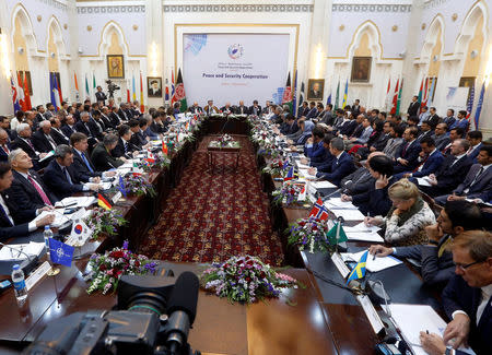 Foreign delegation members listen as Afghan President Ashraf Ghani delivers a speech during a peace and security cooperation conference in Kabul, Afghanistan June 6, 2017. REUTERS/Omar Sobhani