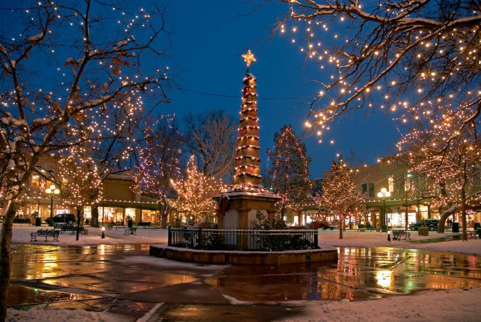 This undated image provided by New Mexico Tourism shows the historic plaza in Santa Fe, N.M., lit up for Christmas. A blend of Spanish, Anglo and Native traditions mark the holiday season in New Mexico. (AP Photo/New Mexico Tourism , Richard Khanlian)
