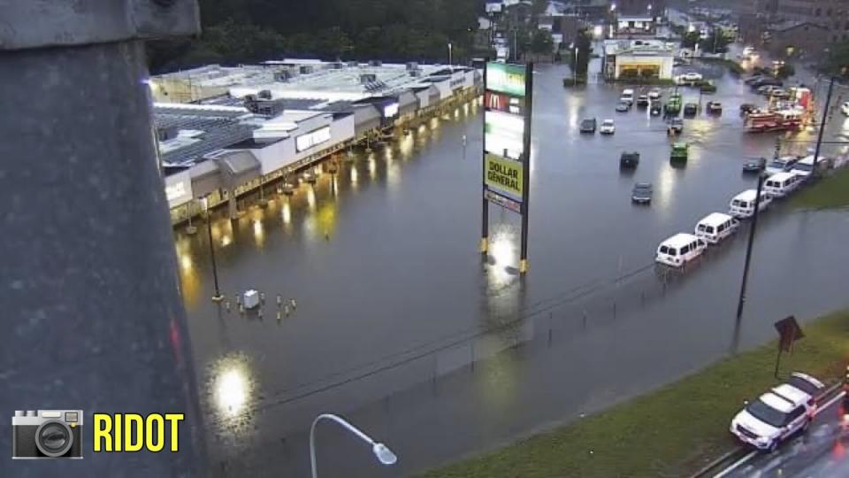 This photo provided by Rhode Island Dept. of Transportation shows flooding at a shopping plaza in Providence, R.I., Monday, Sept. 11, 2023. Heavy rainfall has flooded parts of Massachusetts and Rhode Island, with one city declaring a state of emergency as water poured into homes, creating moats around their foundations, and stranded drivers.(RIDOT via AP)