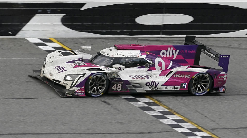 Kamu Kobayashi, of Japan, drives the Ally Racing Cadillac DPi during the final laps of the Rolex 24 hour auto race at Daytona International Speedway, Sunday, Jan. 31, 2021, in Daytona Beach, Fla. (AP Photo/John Raoux)