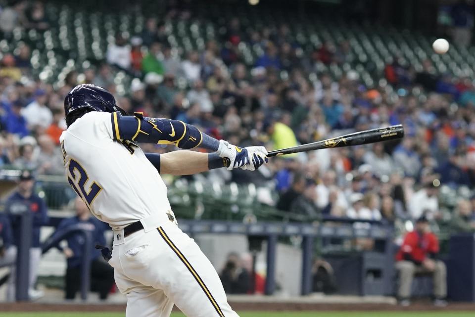 Milwaukee Brewers' Christian Yelich hits a double during the first inning of a baseball game against the Houston Astros Wednesday, May 24, 2023, in Milwaukee. (AP Photo/Morry Gash)