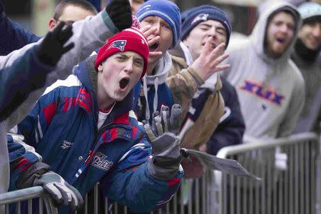 Fans cheer during the New England Patriots Super Bowl XLIX victory parade in Boston, Massachusetts February 4, 2015. REUTERS/Katherine Taylor