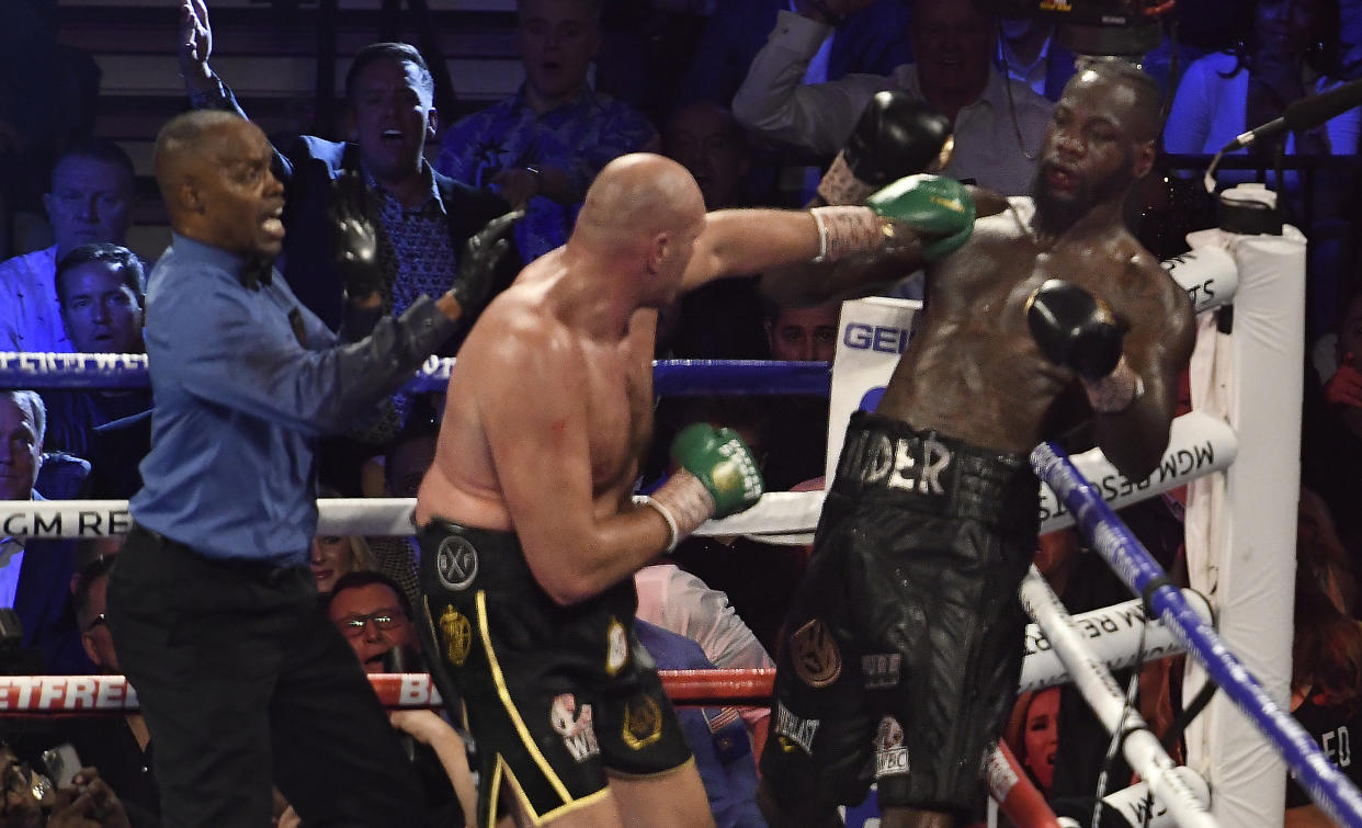 LAS VEGAS, NV - FEBRUARY 22: (in black//yellow trunks) Tyson Fury  goes 7 rounds with Deontay Wilder at the MGM Grand Hotel February 22, 2020 in Las Vegas, Nevada.   Tyson Fury took the win by TKO in the 7th round as the towel was thrown in by the Wilder team for the world heavyweight championship in Las Vegas, Nevada. (Photo by MB Media/Getty Images)