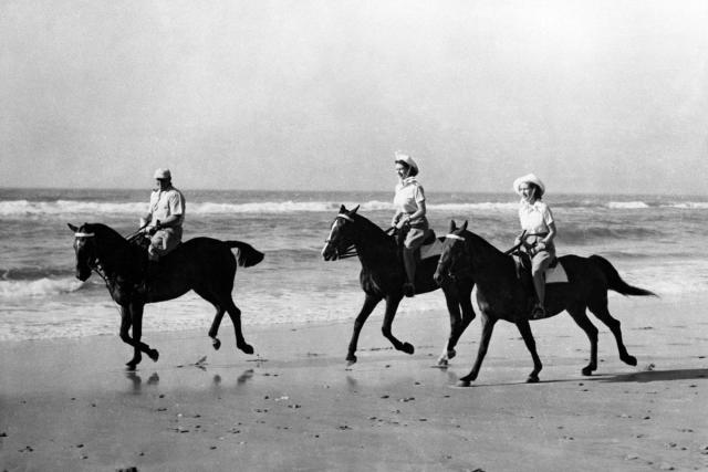 The Princesses enjoyed an off-duty break from the royal tour of South Africa when they went riding on the golden sands of Bonza Beach (PA Images)