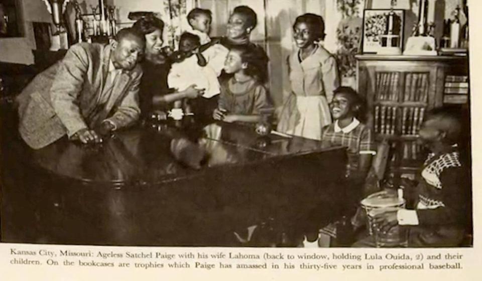 An undated news clipping shows Satchel Paige at home with his wife, Lahoma, and their children.