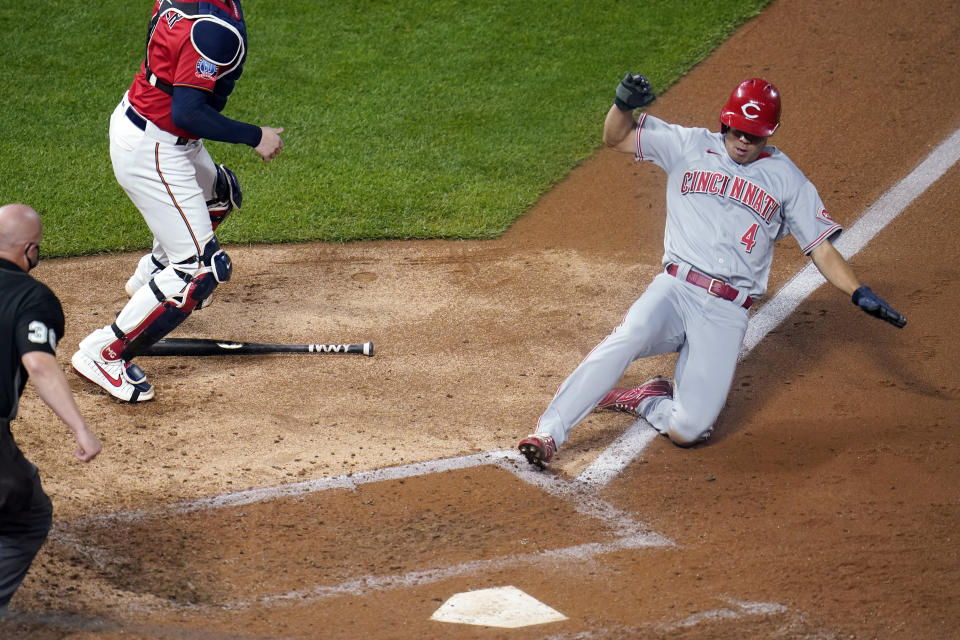 Cincinnati Reds' Shogo Akiyama scores on a hit by Nick Castellanos off Minnesota Twins starting pitcher Jose Berrios during the fifth inning of a baseball game Friday, Sept. 25, 2020, in Minneapolis. (AP Photo/Jim Mone)