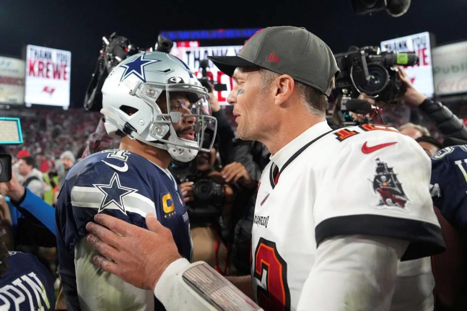 Tampa Bay Buccaneers quarterback Tom Brady (12) and Dallas Cowboys quarterback Dak Prescott (4) greet each other at midfield following an NFL wild-card football game, Monday, Jan. 16, 2023, in Tampa, Fla.