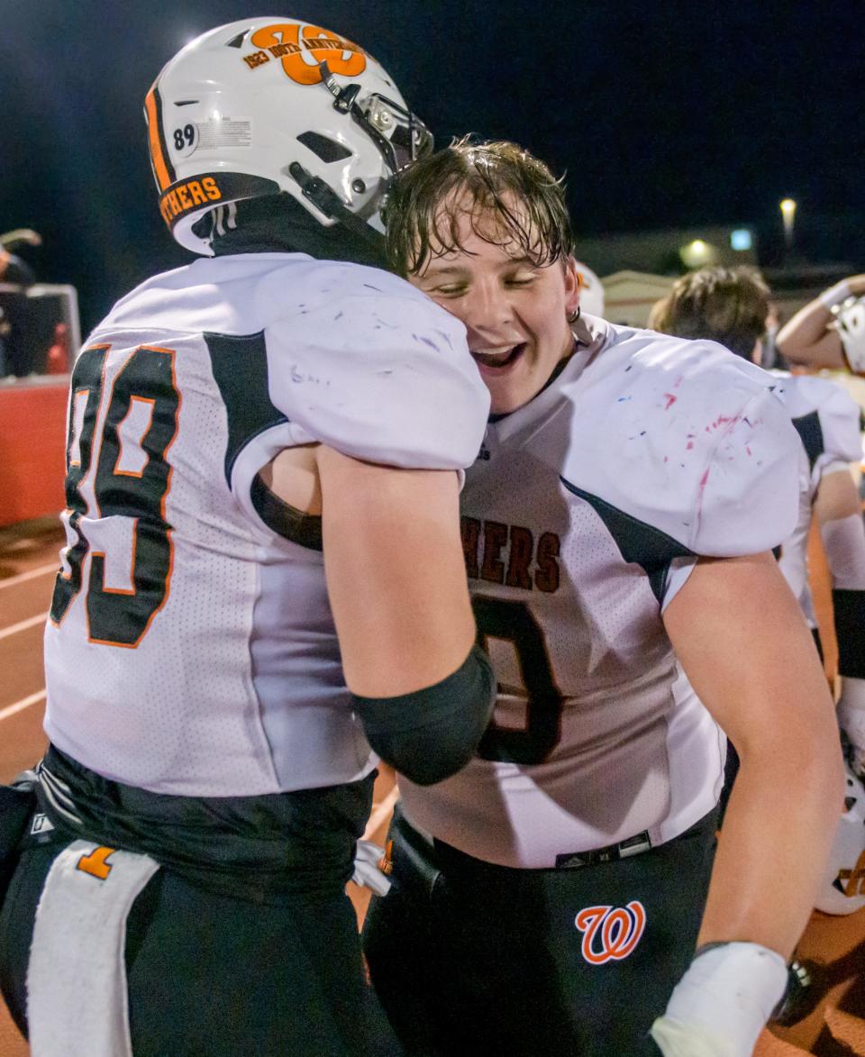 Washington teammates celebrate their 42-21 victory over Morton in a Week 9 football game Friday, Oct. 20, 2023 in Morton. The Panthers clinched the Mid-Illini title with the win.