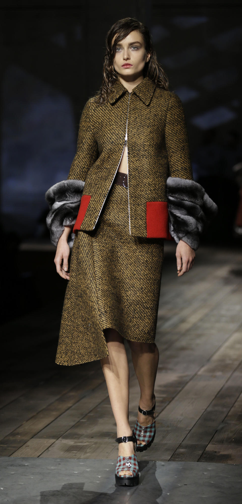 A model wears a creation for Prada women's Fall-Winter 2013-14 collection, part of the Milan Fashion Week, unveiled in Milan, Italy, Thursday, Feb. 21, 2013. (AP Photo/Luca Bruno)