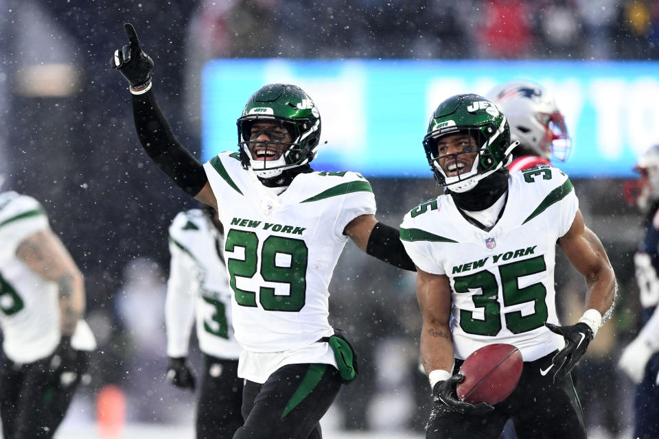 Jan 7, 2024; Foxborough, Massachusetts, USA; New York Jets safety Jarrick Bernard-Converse (29) and running back <a class="link " href="https://sports.yahoo.com/nfl/players/40721" data-i13n="sec:content-canvas;subsec:anchor_text;elm:context_link" data-ylk="slk:Xazavian Valladay;sec:content-canvas;subsec:anchor_text;elm:context_link;itc:0">Xazavian Valladay</a> (35) react after recovering a fumble during the second half of a game against the New England Patriots at Gillette Stadium. Mandatory Credit: Brian Fluharty-USA TODAY Sports