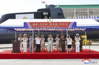 In this photo provided by the North Korean government, North Korea leader Kim Jong Un, center, attends a launching ceremony of what is says a new nuclear attack submarine "Hero Kim Kun Ok" at an unspecified place in North Korea Wednesday, Sept. 6, 2023. Independent journalists were not given access to cover the event depicted in this image distributed by the North Korean government. The content of this image is as provided and cannot be independently verified. Korean language watermark on image as provided by source reads: "KCNA" which is the abbreviation for Korean Central News Agency. (Korean Central News Agency/Korea News Service via AP)