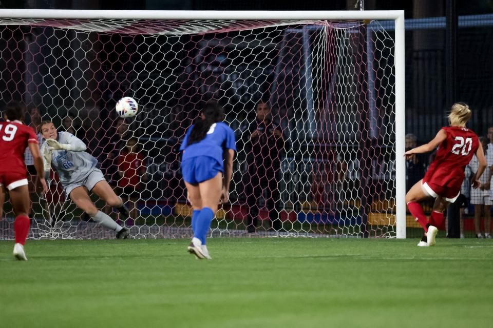 Utah’s Katie O’Kane (20) scores on a penalty kick with BYU’s Savanna Mason (66) in the goal during the game at Ute Field in Salt Lake City on Saturday, Sept. 9, 2023. | Spenser Heaps, Deseret News