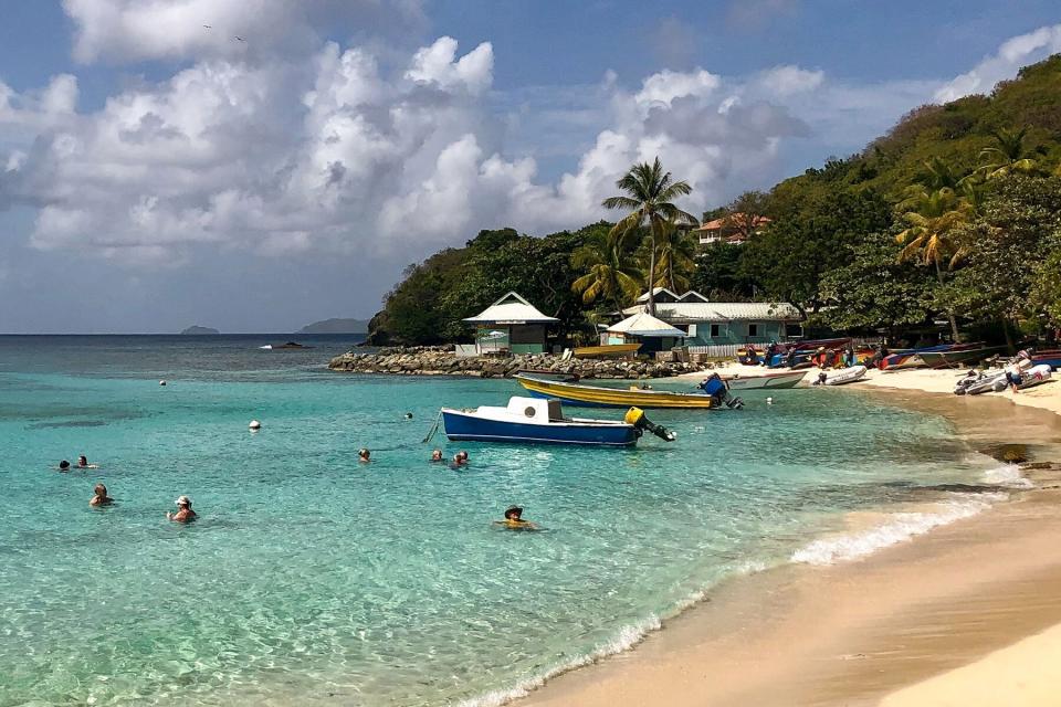 People enjoying the water off the beach on Mustique