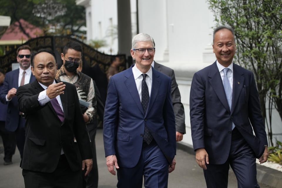 Apple CEO Tim Cook, center, walks with Indonesia’s Minister of industry Agus Gumiwang Kartasasmita, right, and Minister of Communication and Information Technology Budi Arie Setiadi, left, after a meeting with President Joko Widodo at the palace in Jakarta, Indonesia, Wednesday, April 17, 2024.(AP Photo/Achmad Ibrahim)