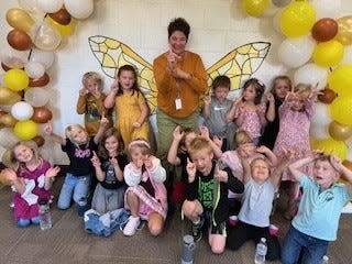 Mrs. Welch poses with her first grade class during the first day of the 2024-25 school year at Pellston Elementary School.