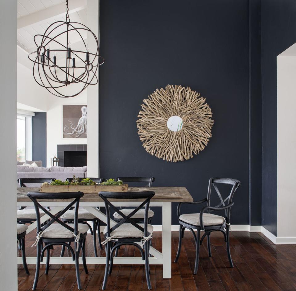 A sophisticated, navy, coastal-inspired dining area