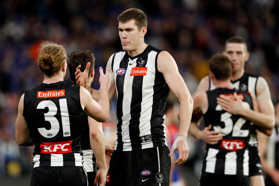 Mason Cox, pictured here celebrating with teammates after Collingwood's win over Melbourne.