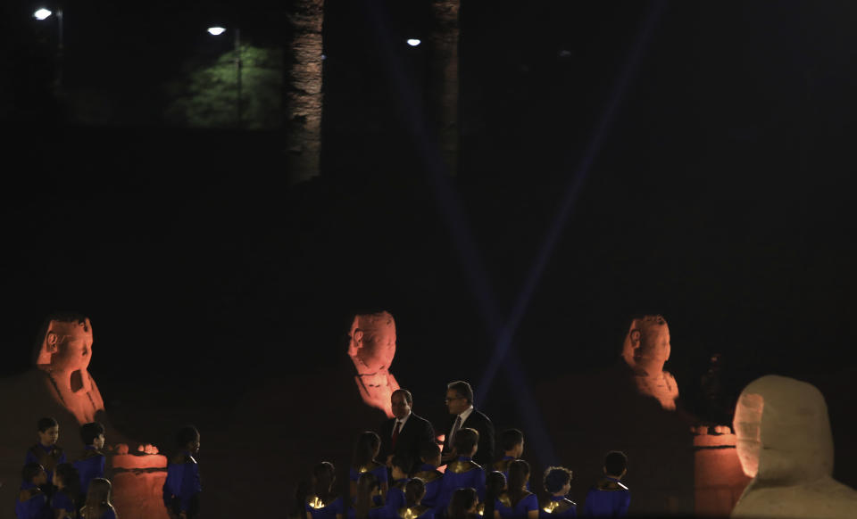 Egypt's President Abdel Fattah al-Sisi and Tourism and Antiquities Minister Khaled el-Enany attend the official ceremony of the opening of the Avenue of Sphinxes commonly known as El Kebbash Road on Thursday, Nov. 25, 2021 in Luxor, Egypt. The ceremony was meant to highlight the country’s archaeological treasures as Egypt struggles to revive its tourism industry, battered by years of political turmoil and more lately, the coronavirus pandemic. (AP Photo/Mohamed El-Shahed)