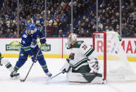 Vancouver Canucks' Alex Chiasson (39) scores against Minnesota Wild goalie Cam Talbot (33) during the second period of an NHL hockey game, Tuesday, Oct. 26, 2021 in Vancouver, British Columbia. (Darryl Dyck/The Canadian Press via AP)