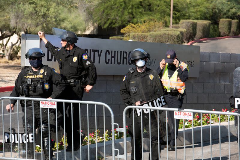 Police block protestors during the visit by U.S. President Donald Trump to the Dream City Church in Phoenix