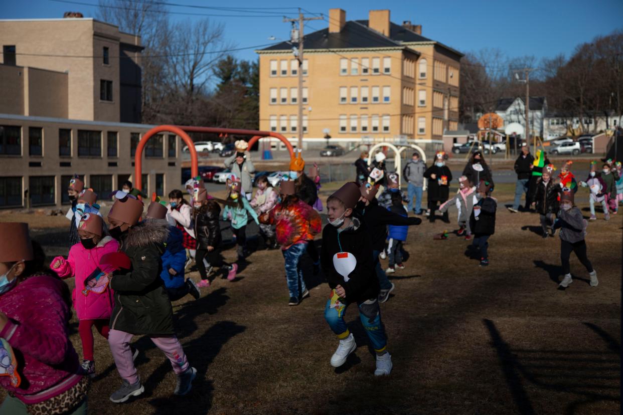 Second-graders of Elm Street School run around their playground during the school's Turkey Trot.