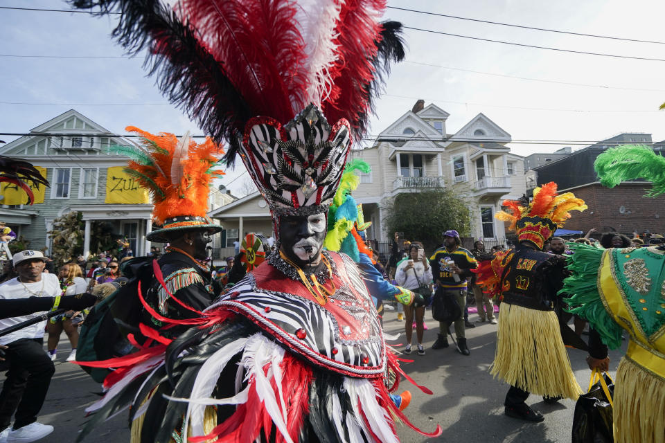 CORRECTS GROUP TO TRAMPS, NOT TRAMS - A member of the traditional Mardi Gras group The Tramps marches during the Krewe of Zulu Parade on Mardi Gras Day in New Orleans, Tuesday, Feb. 21, 2023. (AP Photo/Gerald Herbert)