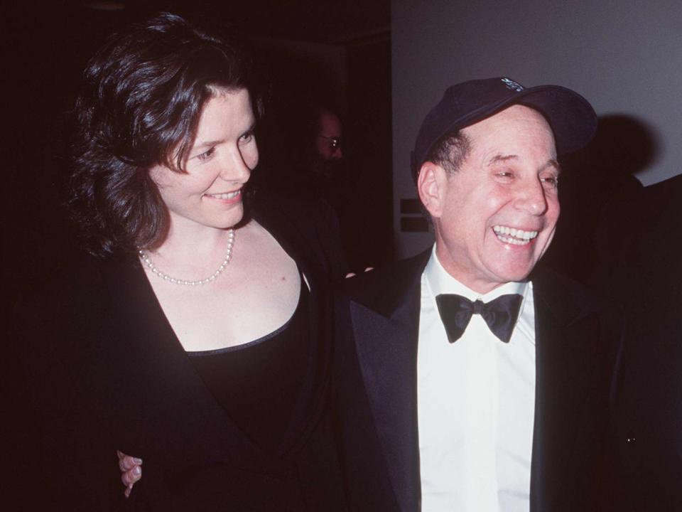 <p>Robin Platzer/Twin Images/Online USA, Inc./Getty</p> Edie Brickell and Paul Simon in New York City in May 1999