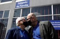 Marcos Castillo and his partner Rodrigo Campos kiss following their marriage ceremony, after Costa Rica legalised same-sex marriage, in San Jose