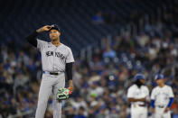 New York Yankees pitcher Luis Gil reacts during the first inning of a baseball game against the Toronto Blue Jays in Toronto on Monday, April 15, 2024. (Christopher Katsarov/The Canadian Press via AP)