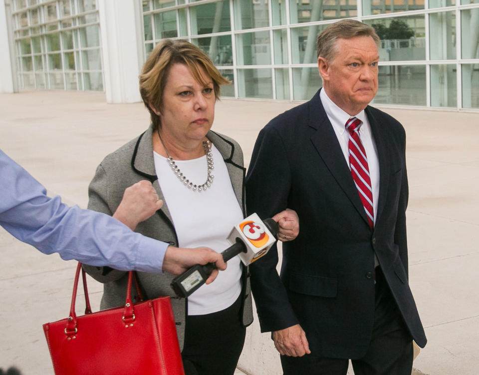 Former Fiesta Bowl executive director John Junker walks out of Sandra Day O'Connor U.S. Courthouse after being sentenced in Phoenix on Thursday, March 13, 2014. Junker was sentenced to eight months in federal prison for participating in a scheme in which bowl employees made illegal campaign contributions to politicians and were reimbursed by the nonprofit bowl. (AP Photo/The Arizona Republic, Michael Schennum) MARICOPA COUNTY OUT; MAGS OUT; NO SALES