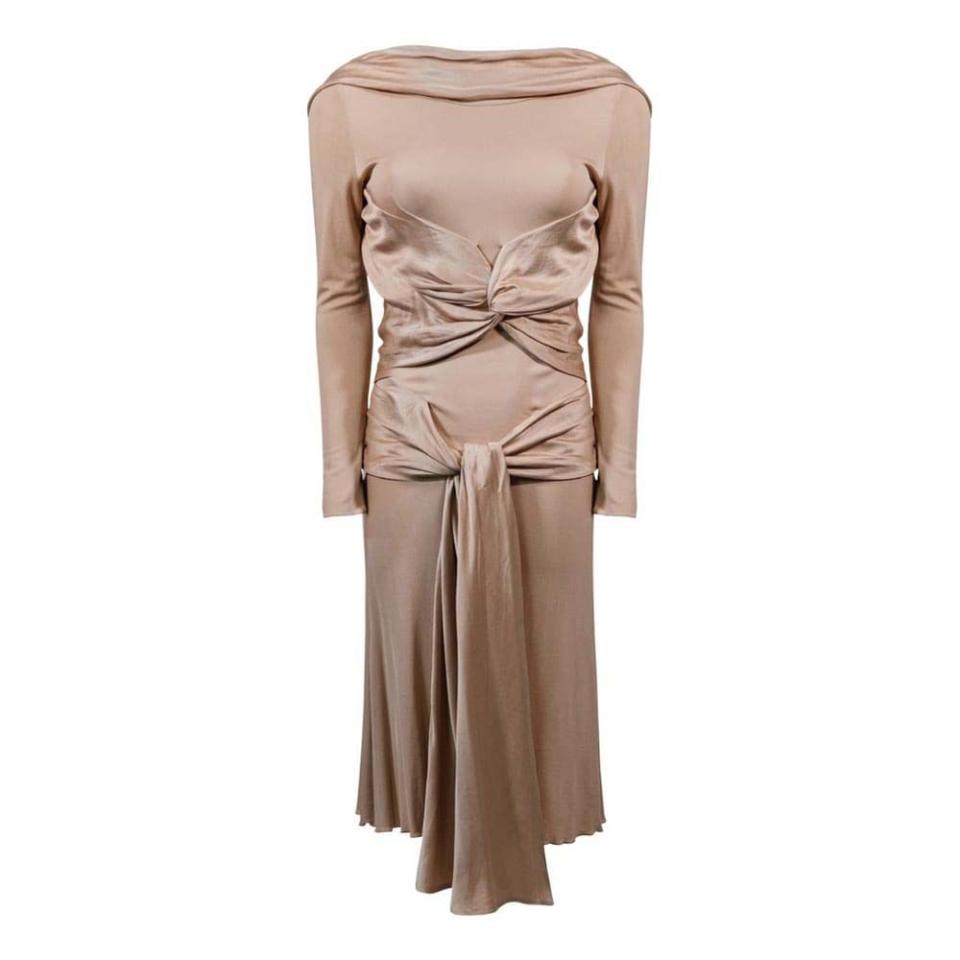 <p><a class="link " href="https://www.vestiairecollective.com/women-clothing/dresses/alexander-mcqueen/pink-silk-alexander-mcqueen-dress-23587971.shtml" rel="nofollow noopener" target="_blank" data-ylk="slk:SHOP NOW">SHOP NOW</a></p><p>2004’s ‘Pantheon ad Lucem’ (‘Towards the Light’) collection was McQueen’s closest brush with minimalism, from the pared-back presentation to the sober colour palette, comprising of nudes and purples. The distinct lack of embellishments served to better showcase McQueen’s impeccable construction. This crepe-jersey dress from look 12, with its 1930s-inspired bias cut and hand-sewn silk ties, is an elegant example.<br></p>