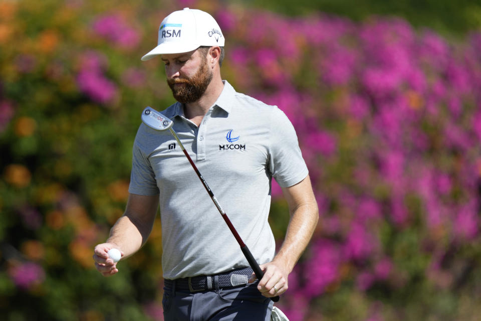 Chris Kirk looks at his ball after making par on the fifth green during the second round of the Sony Open golf tournament, Friday, Jan. 13, 2023, at Waialae Country Club in Honolulu. (AP Photo/Matt York)