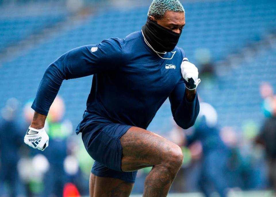 Seattle Seahawks wide receiver DK Metcalf (14) warms up before the start of an NFL game against the California Panthers at Lumen Field in Seattle Wash., on Dec. 11, 2022.