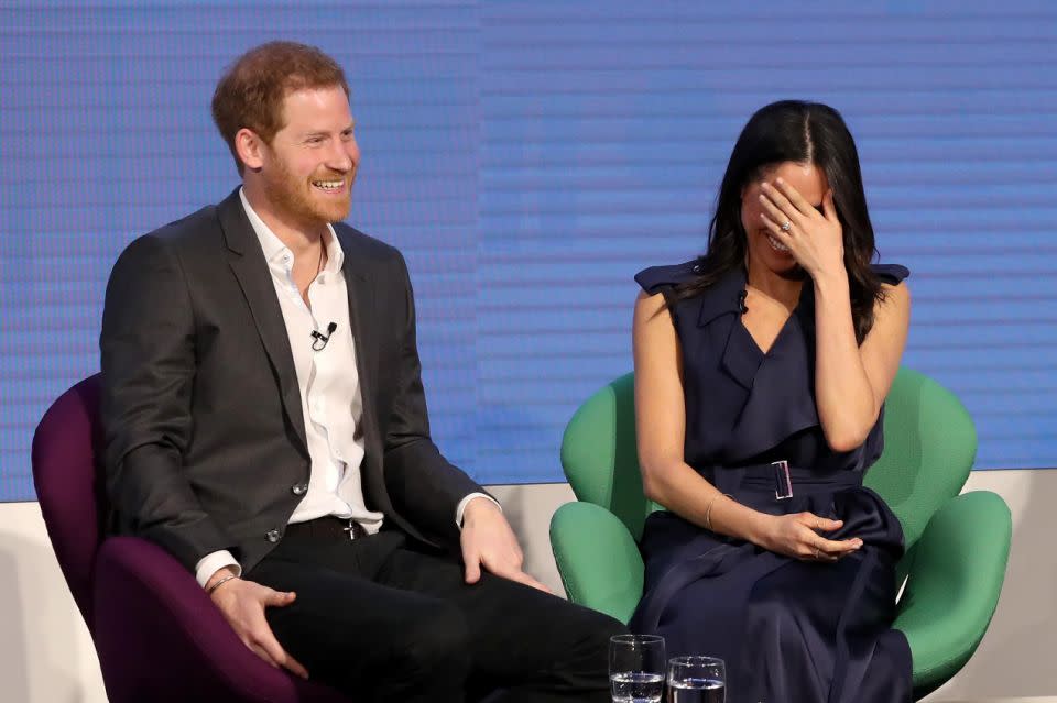 At one stage Meghan covered her face while Prince Harry laughed. Photo: Getty Images