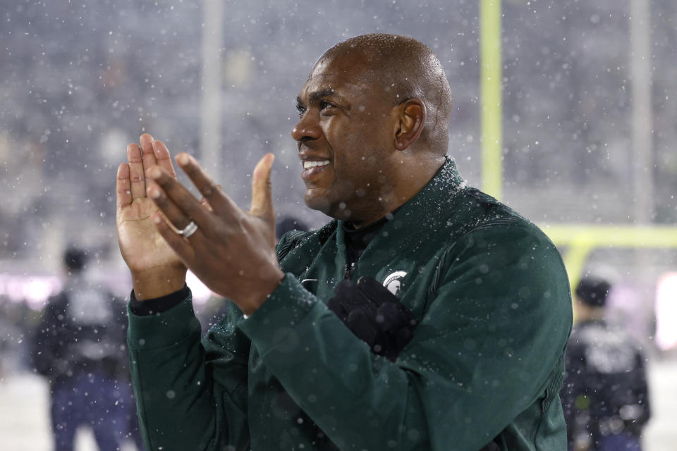 FILE - Michigan State coach Mel Tucker reacts following an NCAA college football game against Penn State, Saturday, Nov. 27, 2021, in East Lansing, Mich. Michigan State won 30-27. Tucker was named coach of the year in the Big Ten in results released Tuesday, Dec. 7, 2021. (AP Photo/Al Goldis, File)