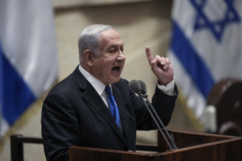 FILE - Former Israeli Prime Minister Benjamin Netanyahu speaks at the Knesset, Israel's parliament, in Jerusalem, June 30, 2022. Israel is holding its fifth national election in under four years, and once again the race is shaping up as a referendum on Netanyahu’s fitness to rule. (AP Photo/Ariel Schalit, File