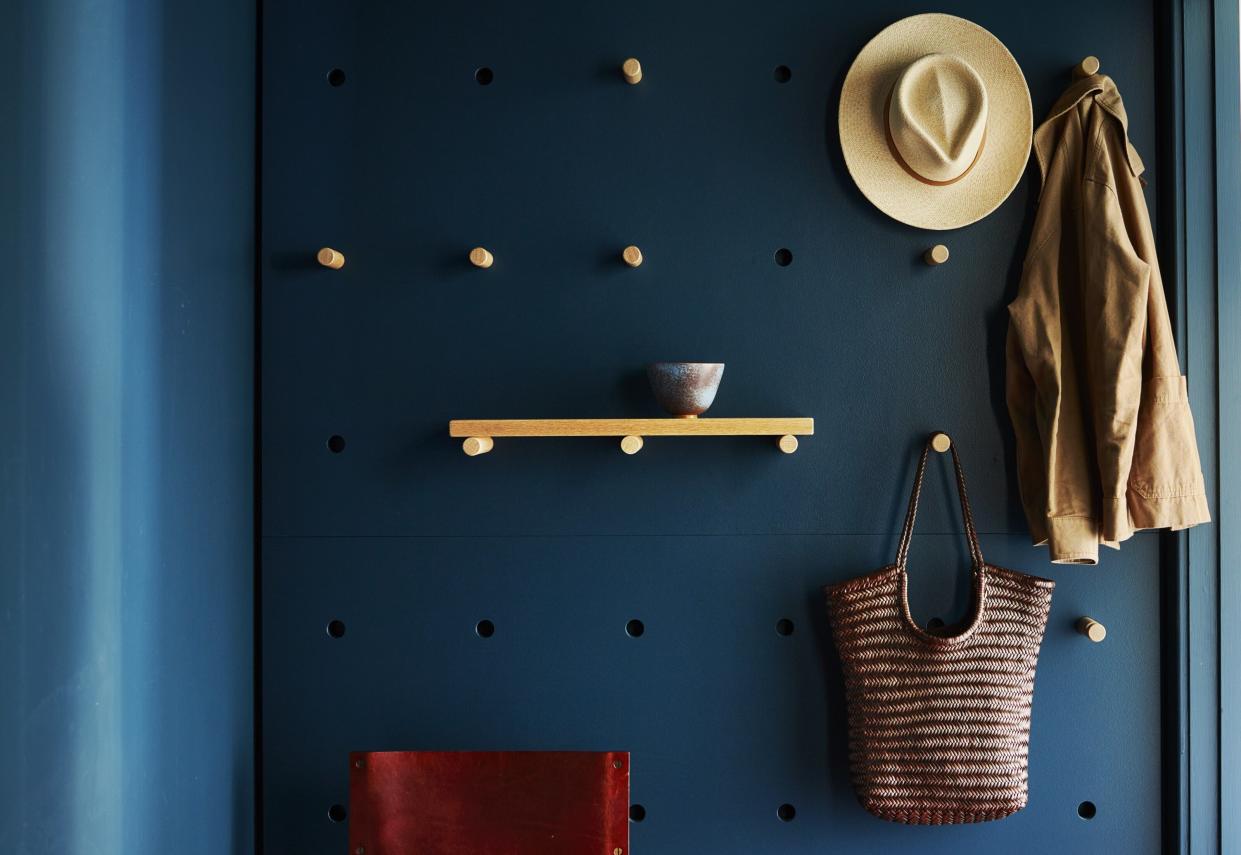  Hanging storage on an entryway pegboard. 