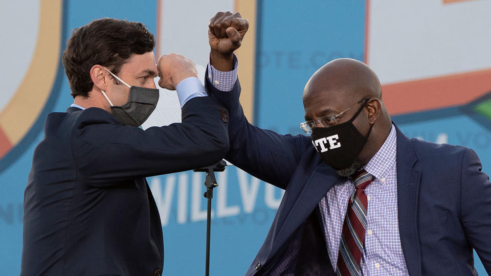 Jon Ossoff, left, and Raphael Warnock