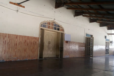 The entrance to a hall of a madrasa situated near an impact site, after Indian military aircrafts struck on February 26, according to Pakistani officials, is seen during a trip organised by the government, in Jaba village, near Balakot, Pakistan, April 10, 2019. Picture taken April 10, 2019. REUTERS/Salahuddin NO RESALES. NO ARCHIVES.