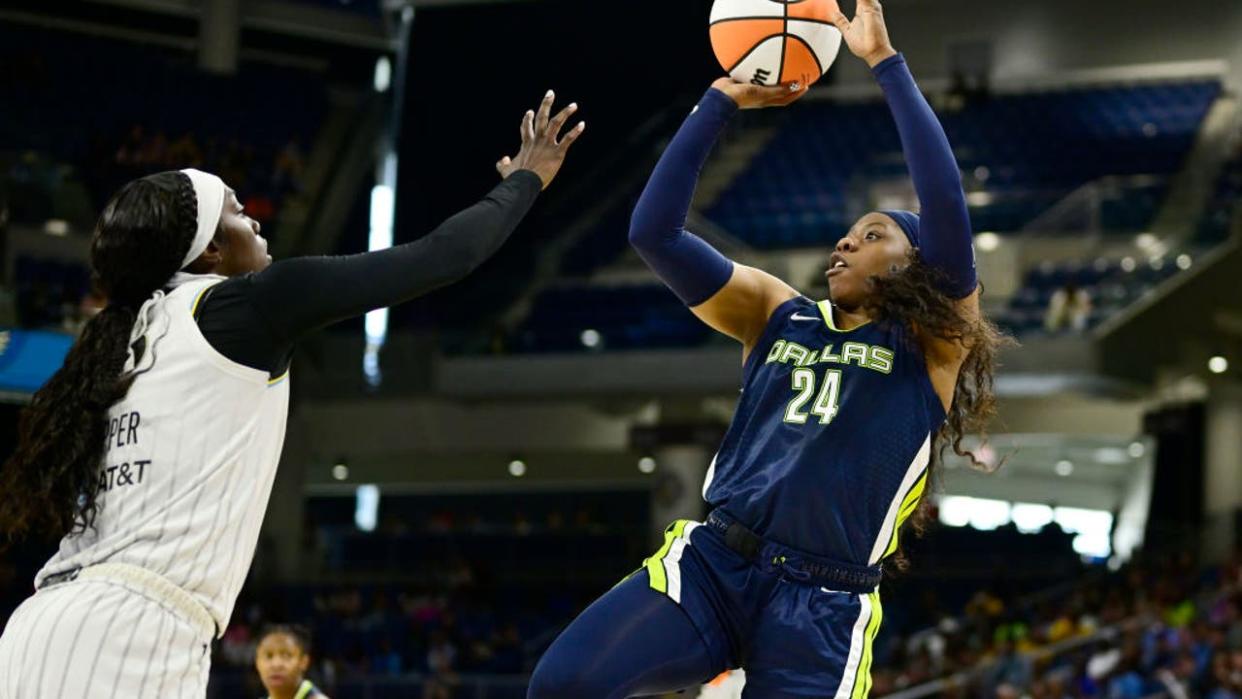 <div>CHICAGO, ILLINOIS - MAY 28: Arike Ogunbowale #24 of the Dallas Wings shoots against Kahleah Copper #2 of the Chicago Sky in the second half at Wintrust Arena on May 28, 2023 in Chicago, Illinois. (Photo by Quinn Harris/Getty Images)</div>